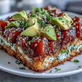 A delightful Crispy Rice Salad with Avocado and Spicy Tuna dish, artfully arranged.