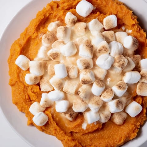 Fluffy sweet potato casserole with a buttery pecan streusel topping, delicious and savory.