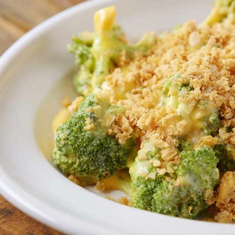 Golden-brown, bubbly Broccoli Casserole with a buttery Ritz cracker topping, ready to serve with dinner.